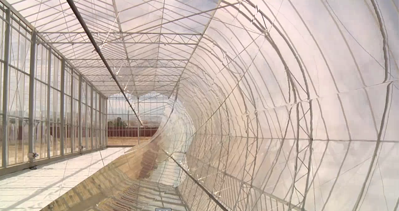 Parabolic mirror inside a glass building heat water to 600 degrees